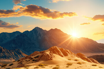 Naklejka premium Breathtaking sunset over vast desert landscape with mountains, showcasing golden rays illuminating sandy dunes and rocky formations