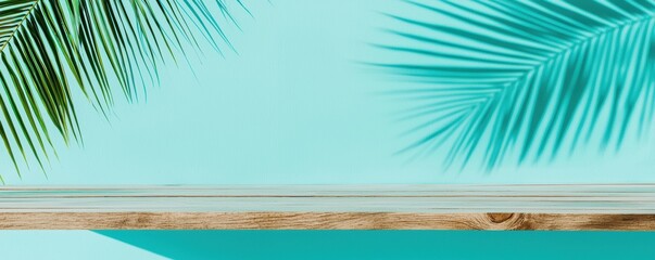 Fototapeta premium A serene view featuring tropical palm leaves against a turquoise backdrop, evoking relaxation and a beachy vibe.
