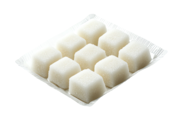 A collection of white sugar cubes arranged neatly on a tray, perfect for sweetening beverages or as a culinary illustration.