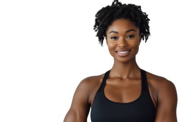 A confident and smiling woman in a fitness outfit, showcasing her strong physique, perfect for health and wellness themes.