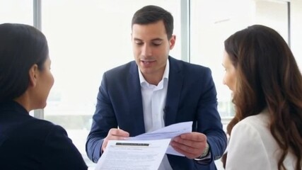 mortgage broker presenting loan approval results client excited couple well-lit office or mortgage broker celebrating approval with clients or successful loan outcomes