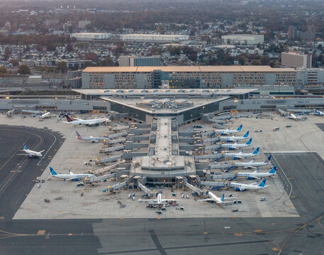 Newark Liberty Airport, Newark, New Jersey, USA - October 31, 2024 - Aerial photograph of the new Terminal A at Newark Liberty Airport EWR featuring United Airlines planes boarding and unloading