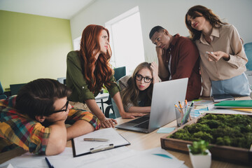 Photo of pretty young colleagues worried discuss project problem startup team coworking successful...
