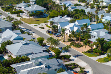 View from above of waterfront neighborhood in Florida with suburban houses. Development of US...