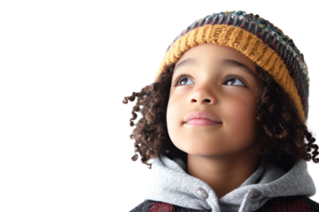 A young child with curly hair wearing a colorful beanie looks upwards with a thoughtful expression against a white isolated background.