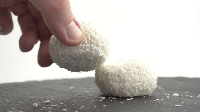 Japanese dessert mochi with red bean filling and coconut flakes