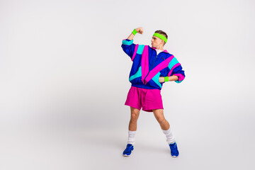 Energetic young man in vibrant retro sportswear against a white background, showcasing a dynamic...