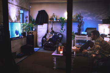 People, man and watching tv on sofa at night with movie, film or television programme for...