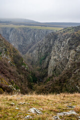 Stunning scenery of turenii gorges in transylvania, romania, featuring rugged cliffs and a winding river cutting through the canyon