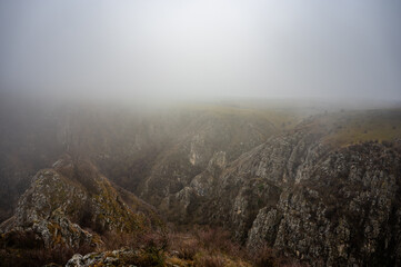 Mysterious fog shrouding the tureni gorge canyon in apuseni natural park, transylvania, romania, creating an evocative and captivating landscape