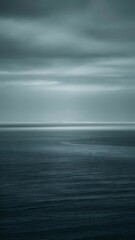 Obraz premium Cloudy blue minimalist seascape. Deserted space. Horizon line. Background.