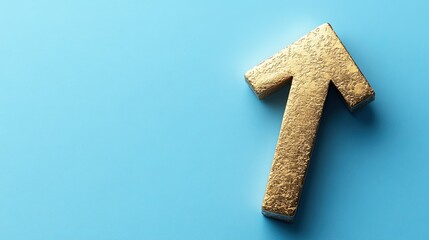 Obraz premium Solid gold upward arrow on a blue background symbolizing growth and success 