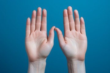 Elegant Female Hands on a Serene Blue Background