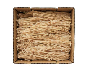 Top view of open cardboard box with shredded wood excelsior or wood wool for filling inside. Using natural sustainable material for wrapping or products background. Isolated on white, studio shot.