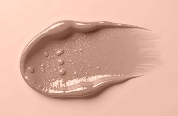 Fototapeta premium Oil or cream or scrub macro texture smears. Skincare Texture Swatch. Natural gel smears or drops. Demonstration of Color of the year 2025. Color of the year. Mocha Mousse.