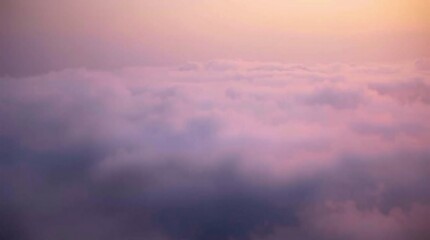 Fototapeta premium Celestial Canvas: A breathtaking panoramic vista of ethereal clouds bathed in the soft glow of a golden sunset, capturing the serene beauty of nature's artistry. 