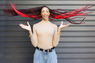 A Joyful Woman with a Unique and Creative Hairstyle is Expressing Her Happiness Boldly