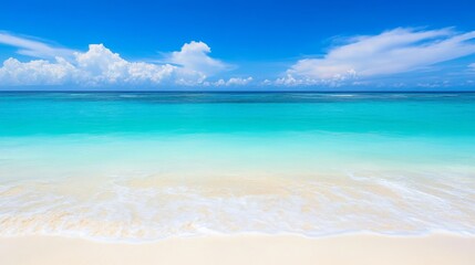 Obraz premium Vibrant beach with clear blue water and sky.