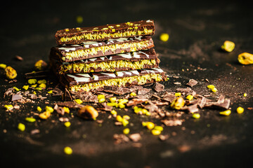 Trendy homemade Dubai chocolate on dark background