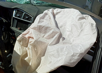 Airbag deployment in a car interior after an accident