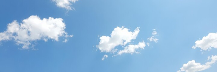 Fototapeta premium Clear blue sky on a sunny day with fluffy white clouds, day, daytime