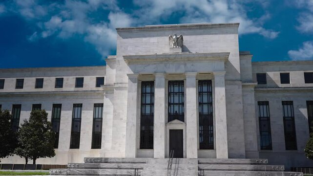 Time lapse footage showcases the Federal Reserve building in Washington DC, emphasizing its role in managing the economy, interest rates, and inflation.