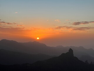 Obraz premium Roque Bentayga is a rock formation on the island of Gran Canaria. Wonderful view to Rogue Bentayga from evening walk in mountain trail. Sunset view.