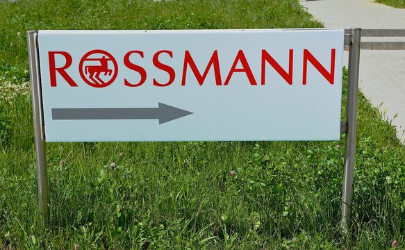 Kielce, Świętokrzyskie, Poland - 2022-06-07 - Rossmann logo with an arrow pointing to a store.