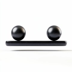 Black spheres balanced on dark rectangular base.