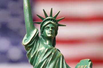 Statue of Liberty against flag of USA, closeup