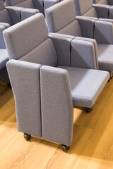 Fototapeta premium chairs for halls, the ability to quickly organize an area for spectators and remove it, adjust the number of seats, their location in the hall