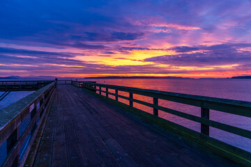 Fototapeta premium Vivid Sunrise Over Pier in Sidney on Vancouver Island, BC, Canada