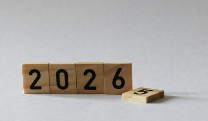turn of the year 2025 2026 wooden blocks