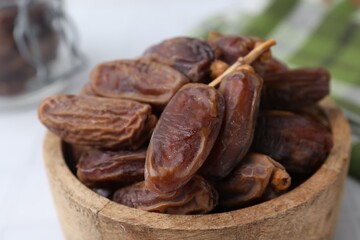Obraz premium Tasty dried dates on white table, closeup