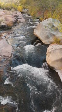 Slow Motion Vertical Overhead View Of Rushing Water On Oak Creek In Sedona, AZ. 