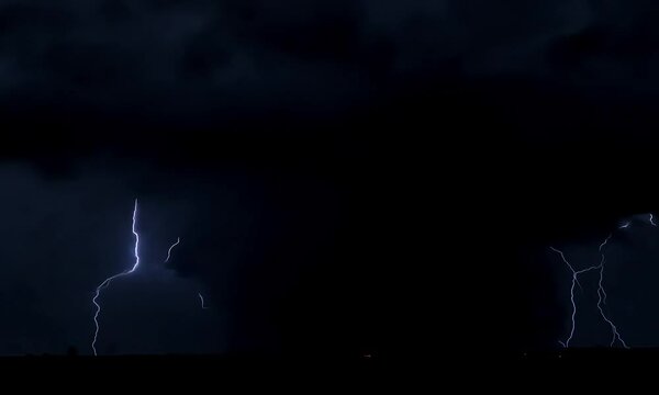 black thunderclouds over village outskirts timelapse lightning footage