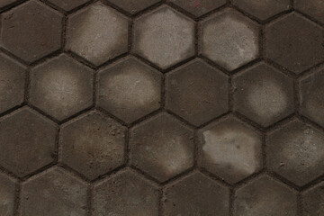 A dark and white hexagonal floor background with textured tiles, offering a modern, geometric...