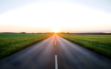 Fototapeta premium Inspiring Straight Road Through Green Pastures Toward Sunrise, Symbolizing Growth and Achievement