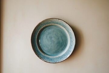  Ceramic Welcome Plate Hanging on a Cream Wall  