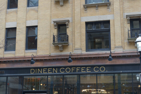 facade of Dineen Building, a heritage property, designed by FH Herbert, 1897, located at 140 Yonge St in Toronto, Canada - Dineen Coffee Co