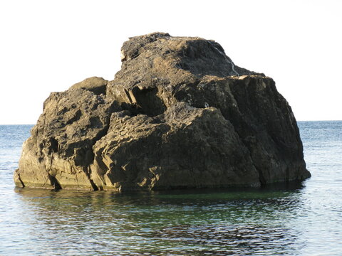 A large dack gray boulder in the Black Sea, Crimean Peninsula, Ukraine