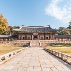Obraz premium Ancient Asian temple with stone pathway, clear sky.