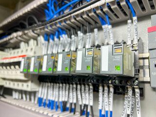 Electrical terminals for connecting the mounting wires in the control panel close-up.