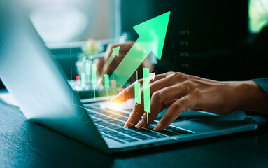 Businessperson Analyzing Stock Market Data on Laptop with Green Upward Arrow and Candlestick Chart,...