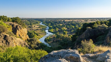 Scenic River Valley Surrounded by Lush Green Landscape and Cliffs
