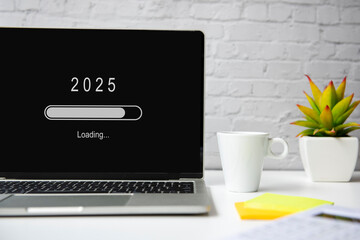 Loading year 2025 for start new business and new life. Equipment working in office with coffee...