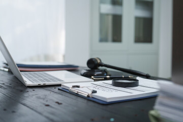 A neatly arranged lawyer's desk with a gavel, legal documents, and scales of justice, symbolizing...