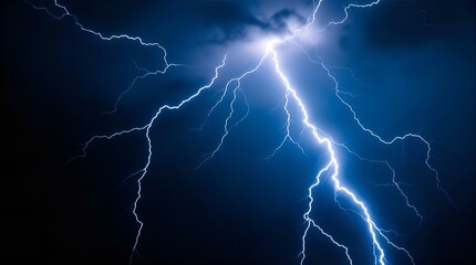 Dramatic Night Scene of a Powerful Lightning Bolt Striking Across a Dark Blue Sky, Captured from a Low-Angle Perspective