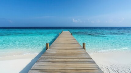 Obraz premium Travel image showing a wooden pier leading into the turquoise ocean on an exotic beach