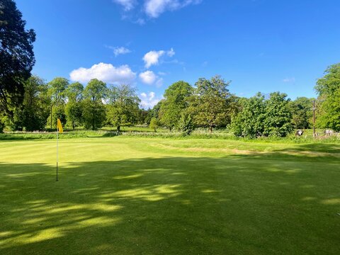 A view of a beautiful parkland golf golf surrounded by trees, in Scotland, United Kingdom